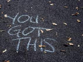 writing on road that says You Got This