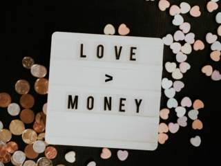 Image of a sign saying Love and Money